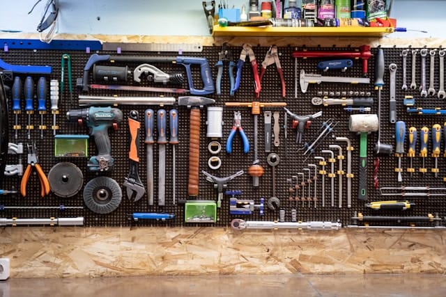Tools and hardware arranged on a workbench